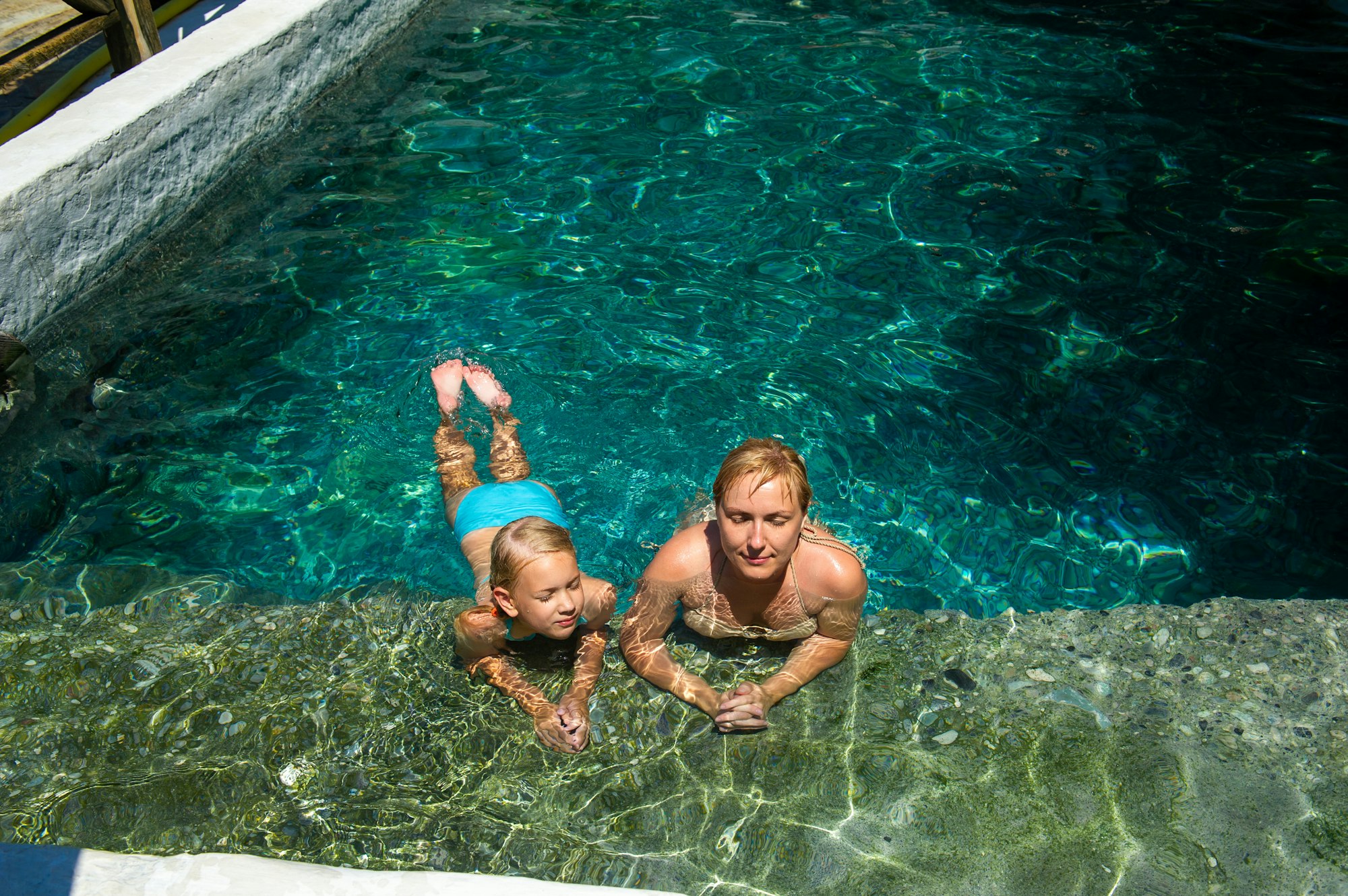 A happy family takes in a hydrogen sulfide treatment pool at a resort in Turkey