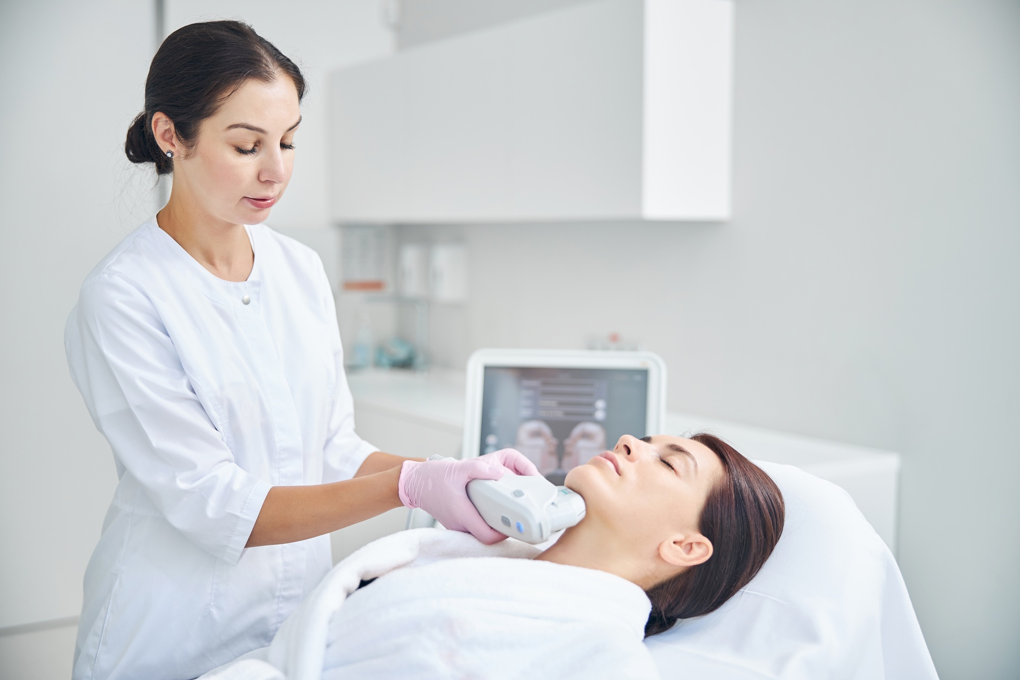 Relaxed lady getting a skin tightening treatment