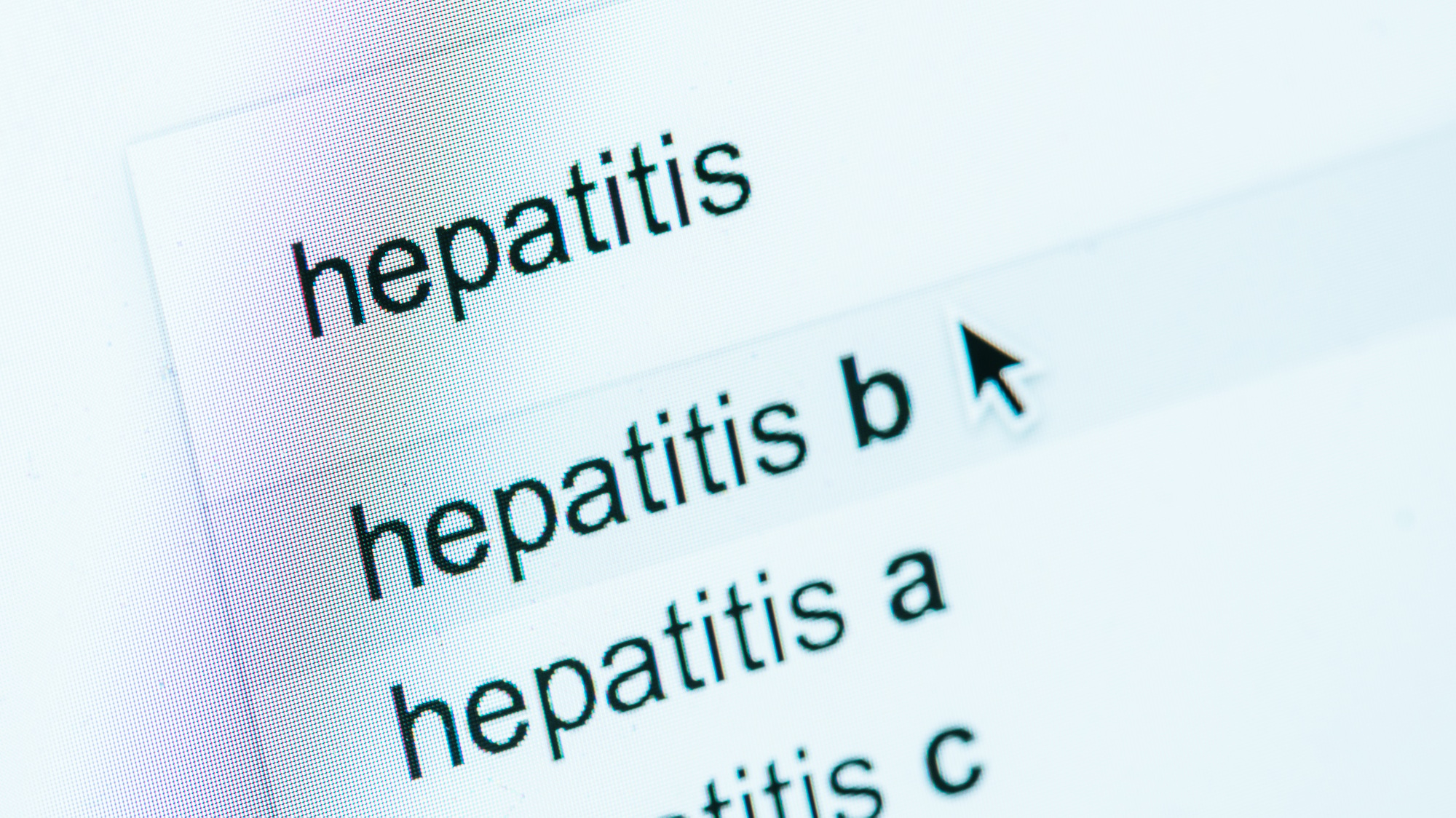 close up view of computer screen with lettering hepatitis a, b, c, world hepatitis day concept