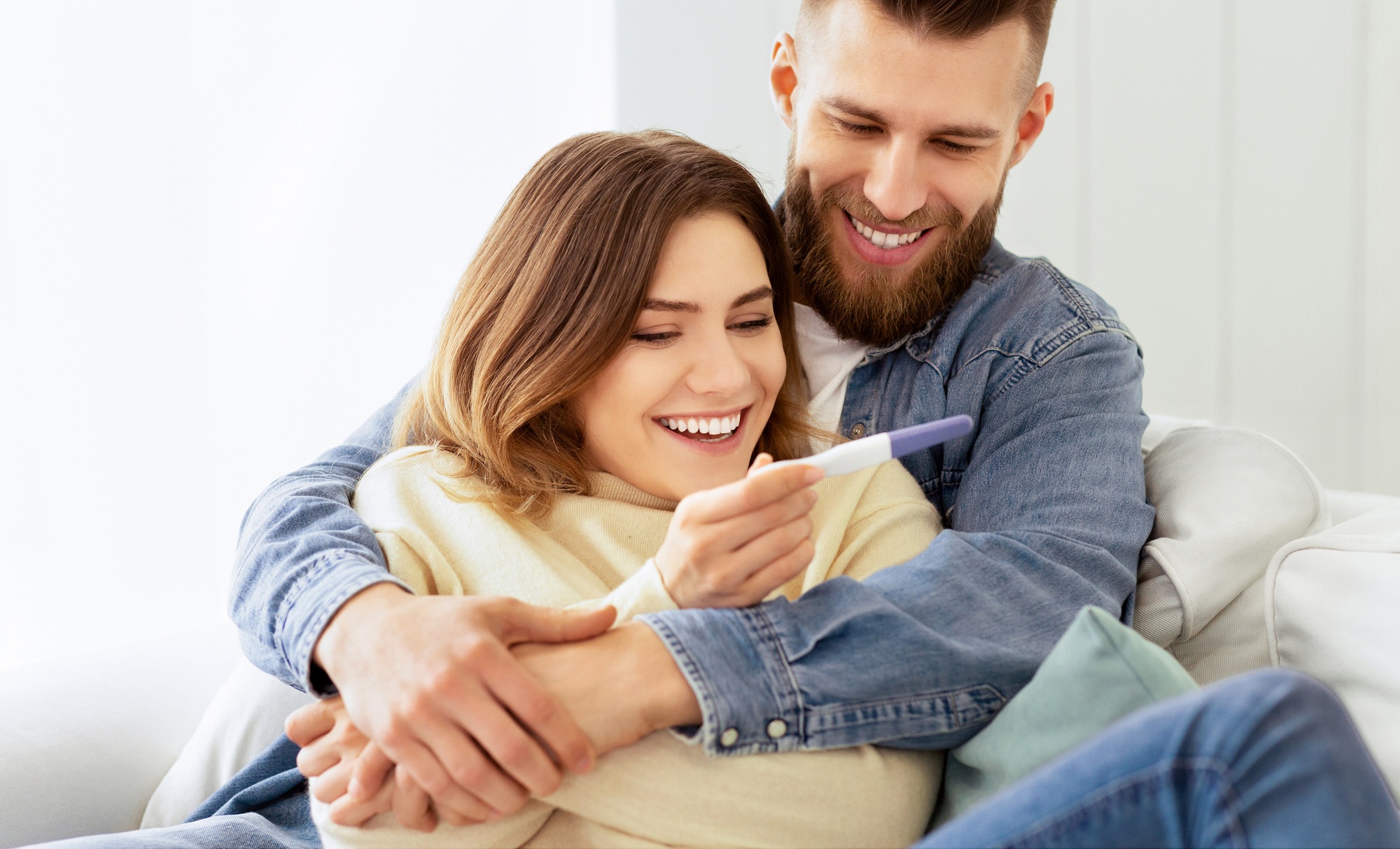 I'm Pregnant! Happy Couple Checking Pregnancy Test