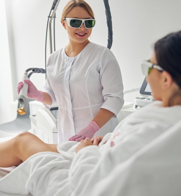 Doctor holding a laser hair removal device